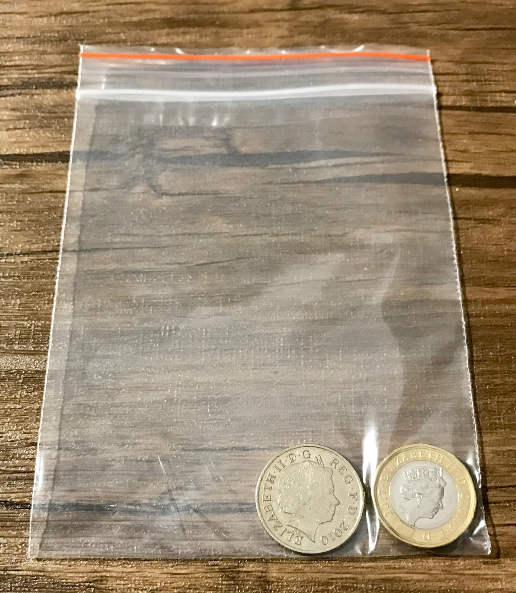 Split Coin Magic - 10p Split Coin Magic Trick -  Coin Thru Bag